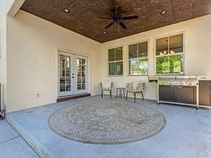 View of patio / terrace with ceiling fan, french doors, and area for grilling
