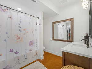 Bathroom with vanity and shower / bathtub combination with curtain