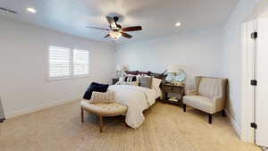 Bedroom with light colored carpet, a ceiling fan, and recessed lighting
