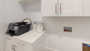 Laundry area featuring cabinet space and washer hookup