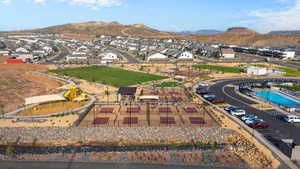 Aerial view of residential area featuring a mountainous background