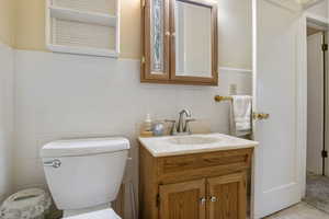 Bathroom with tile walls and vanity