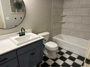Full bath featuring tile patterned floors, vanity, and shower / bathtub combination