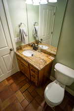 Half bath with vanity and toilet