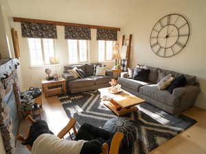 Living room featuring a fireplace and light wood-style flooring