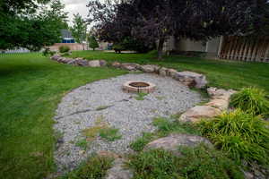 View of yard with a fire pit