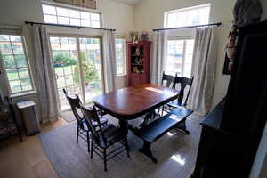 Dining area with plenty of natural light and light wood finished floors