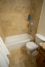 Bathroom with vanity, shower / washtub combination, and tile patterned floors