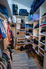 Spacious closet with light wood-style flooring