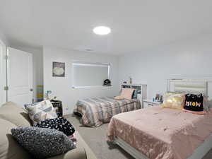 Carpeted bedroom with baseboards