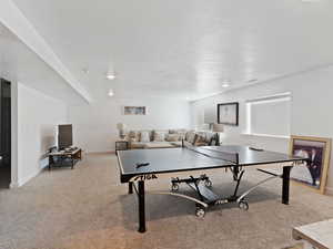 Game room with carpet flooring