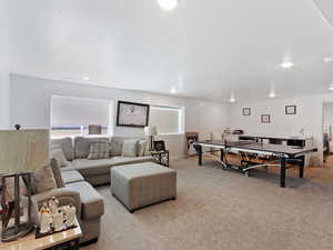 Living room featuring light colored carpet