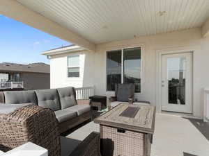 Wooden terrace featuring outdoor lounge area