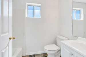 Bathroom with toilet and vanity