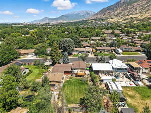 Aerial view of residential area featuring a mountain backdrop