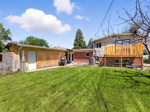 Back of house with french doors and a wooden deck