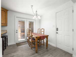 Dining area featuring a chandelier and light wood finished floors
