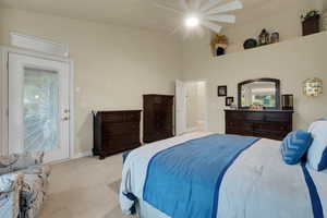 Bedroom with light colored carpet and ceiling fan