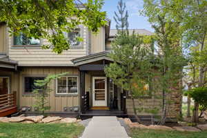 View of exterior entry with board and batten siding