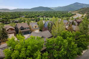 Aerial view of residential area featuring a mountain backdrop