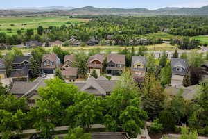 Aerial view of residential area featuring a mountain backdrop