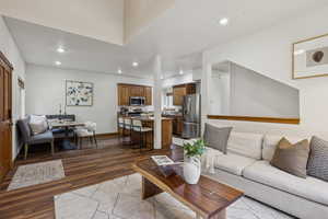 Living room with wood finished floors and recessed lighting