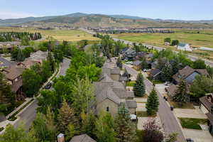 Aerial view of residential area featuring a mountainous background