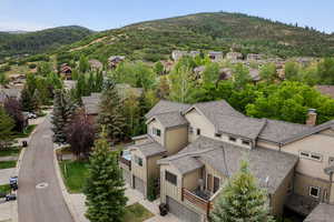 Aerial perspective of suburban area with a mountain backdrop