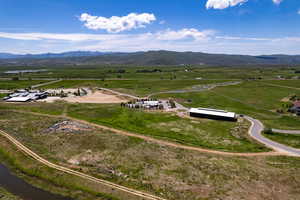 Aerial view of sparsely populated area with a mountain backdrop