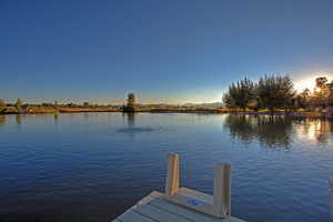 Dock area featuring a water view