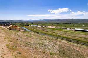 View of mountain background featuring rural landscape
