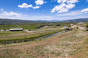 View of mountain backdrop with rural landscape