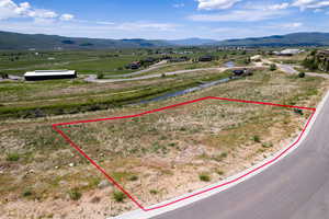 Overview of rural landscape with property boundaries highlighted and mountains