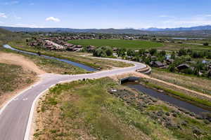 Aerial perspective of suburban area featuring a water and mountain view