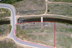 Aerial view of property and surrounding area with property parcel outlined