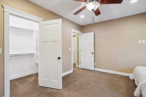 Bedroom featuring carpet flooring, recessed lighting, ceiling fan, and a closet