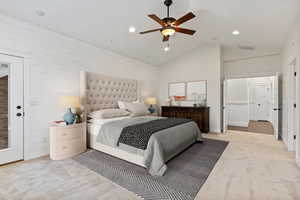 Bedroom featuring wood walls, light colored carpet, ceiling fan, access to outside, and recessed lighting