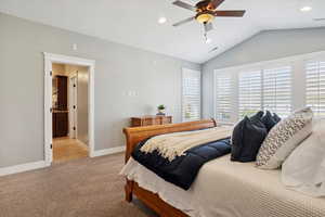 Bedroom with light carpet, vaulted ceiling, recessed lighting, and a ceiling fan