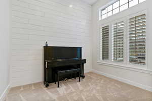 Sitting room featuring carpet floors