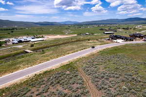View of mountain backdrop with rural landscape
