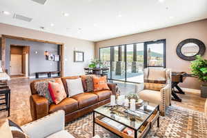 Living area featuring wood finished floors and recessed lighting