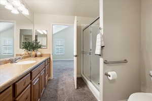 Full bathroom with a shower stall and vanity