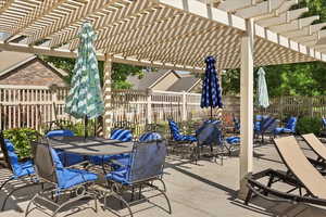 View of patio / terrace featuring outdoor dining area and a pergola