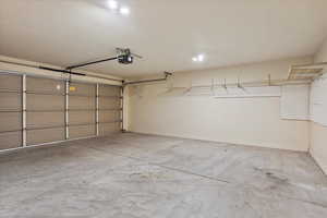 Garage featuring baseboards