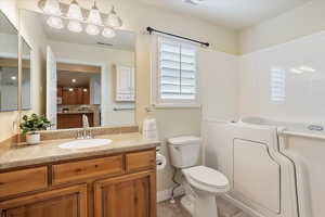 Full bathroom with vanity, tile patterned flooring, and a tub