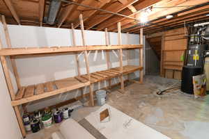 Unfinished basement with strapped water heater