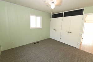 Unfurnished bedroom featuring carpet floors and a closet