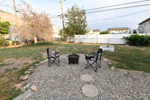 View of yard with a fire pit