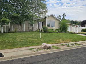 View of front of house with brick siding and a garage
