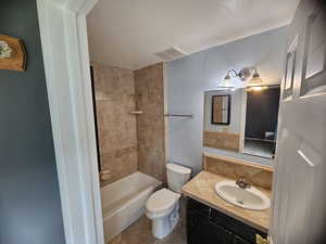 Full bath with vanity, tile patterned flooring, and bathtub / shower combination
